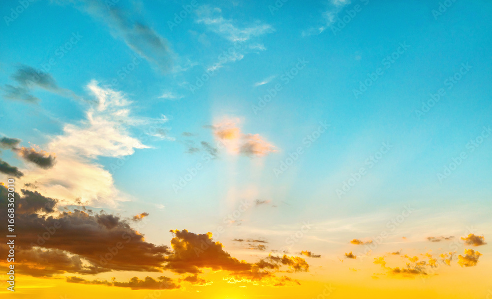 Wall mural sky is beautiful shade of blue with few clouds scattered throughout