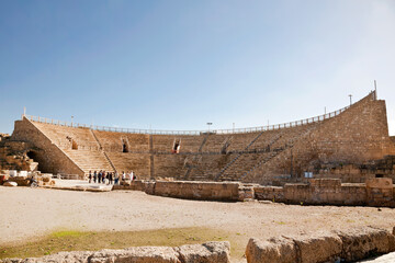 Tourists near the Roman Amphitheater in Caesarea National Park on the Mediterranean coast of Israel