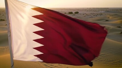Qatar flag flying over desert landscape during sunset - Powered by Adobe