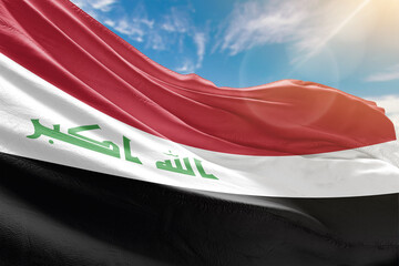 A vivid collection of national flags fluttering under the sunlit sky, representing the colors and pride of diverse nations around the world.