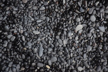 Round pebbles on volcanic beach
