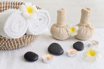 Composition with spa accessories and tropical flowers on massage table
