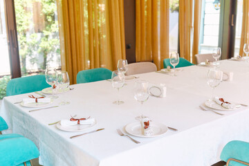 Elegant dining table set for a special occasion in a bright restaurant