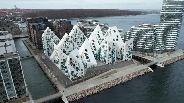 Aarhus, Denmark &ndash; March 26, 2025: Aerial view of the modern residential district Aarhus &Oslash; with the iconic Iceberg buildings (Isbjerget). Contemporary Scandinavian architecture by the waterfront with u