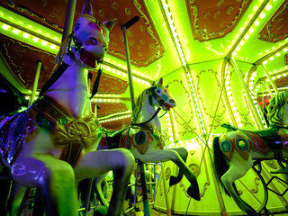 illuminated carousel at amusement park