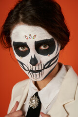 Couple enjoys heritage with a striking sugar skull face paint for Dia de los Muertos festivities