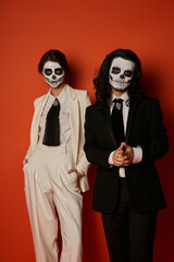Couple honours heritage with striking sugar skull faces for Dia de los Muertos in attire