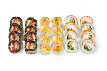 Sushi set displaying variety of rolls with different toppings and fillings