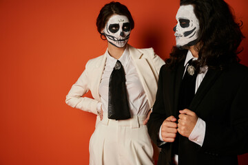 Couple honours the colors of Dia de los Muertos with sugar skull art and elegant attire