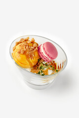 Delicious ice cream dessert with macarons and crumble topping