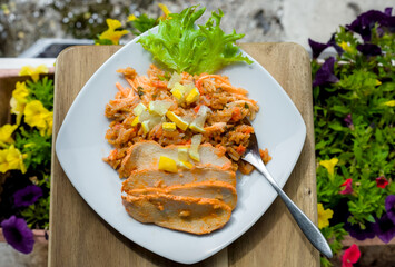 Top Down View of Gourmet Marinated Spicy Piri Piri Chicken Breast with Long Grain Rice, Lemon, Roasted Red Peppers and Onions