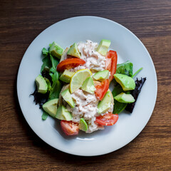 Top Down View of Surimi Pollock and Prawns Tangy Seafood Sauce Salad on Toast with Avocado and Tomato