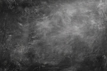 Obraz premium Monochromatic abstract texture with dark gray and lighter gray hues, showing brushstrokes and a mottled effect, creating a distressed, aged look
