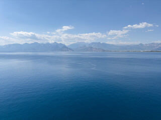 deep blue sea and beautiful distant mountains