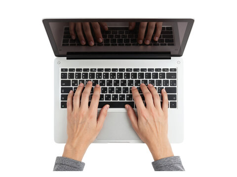 Overhead view of a person typing on a modern laptop keyboard with hands visible on transparent background isolated on transparent background