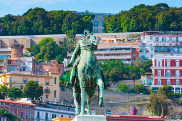 The Monument to Armando Diaz in Naples, Italy. The green bronze equestrian statue stands before the...