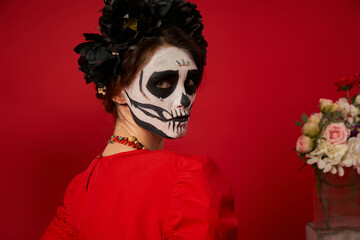 Woman remembers heritage with sugar skull makeup during Dia de los Muertos festivities