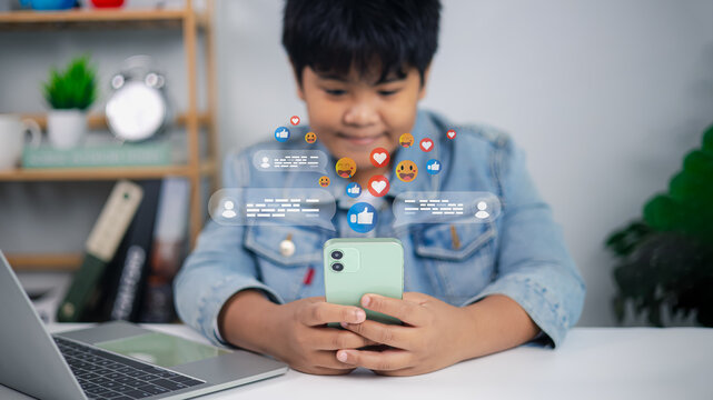Asian boy using smartphone with social media icons and online communication concept
