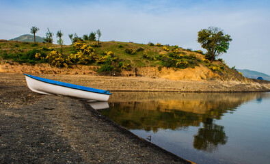Beautiful landscape of lake and reflection of blue sky, clouds and mountains on surface of lake, Panoramic view of lake and snow-covered mountain and Forest trees calm in Jijel Algeria North African.
