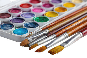 Colorful watercolor paints and brushes in a box