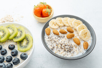 Healthy oatmeal bowl with banana almonds and chia seeds