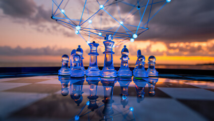 Transparent chess pieces with a network sphere against a vibrant sunset backdrop