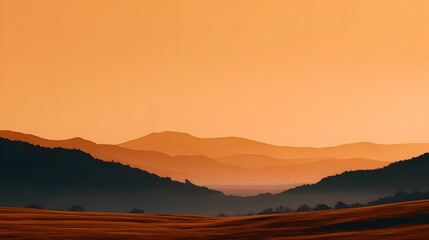 Serene Mountain Landscape at Sunset with Gradients of Orange and Silhouette of Rolling Hills