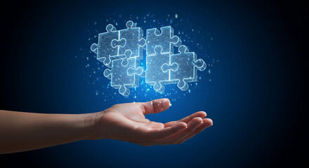Hand holding glowing puzzle pieces representing teamwork, collaboration, and business solutions