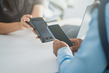 Mobile payment transaction with smartphone and card reader, digital technology and contactless finance concept in modern business.