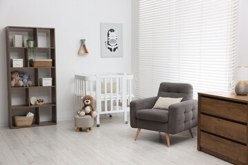 Baby's room with crib and armchair. Interior design