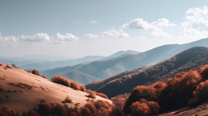 Golden autumn hills cascade down to vibrant orange trees with misty blue mountains rising under the sky
