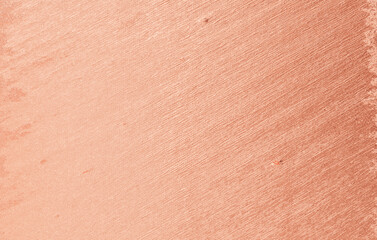 Peach plaster wall texture with soft rough surface and gradient shades, warm abstract background for design, art, and decoration.