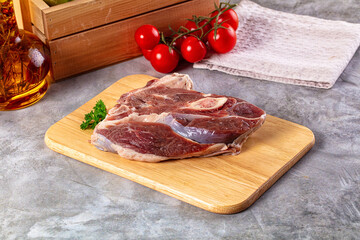 Raw lamb steak with bone