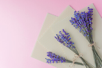 Lavender bouquets on beeswax sheets with pink background