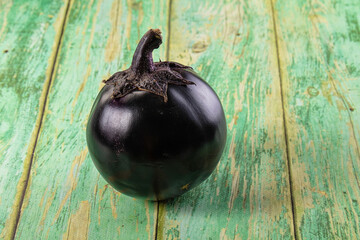 Raw round black big eggplant