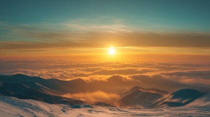 Vast snow peaks rise above a golden cloud layer bathed in warm light from the setting sun