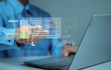 Businessman points to virtual project management dashboard showing Gantt charts, analytics and...