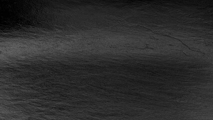 Fototapeta premium Black silk fabric texture with smooth folds and shiny surface, elegant luxury background for design and decoration.