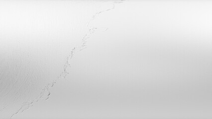 Close-up of shimmering silver metallic foil texture with polished, reflective highlights — a modern and luxurious backdrop perfect for elegant, futuristic, or high-end design concepts.