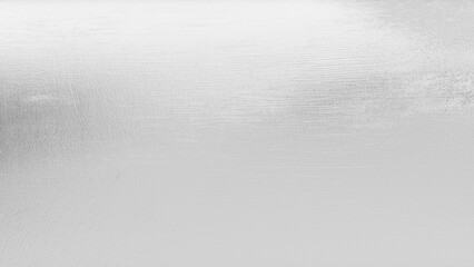 Close-up of shimmering silver metallic foil texture with polished, reflective highlights — a modern and luxurious backdrop perfect for elegant, futuristic, or high-end design concepts.