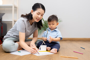 An Asian mother and son do activities together at home, such as dressing up, playing games, playing ball, and drawing.