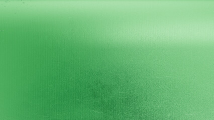 A close-up of metallic green foil texture with reflective details, perfect for festive, eco-themed, or modern abstract design backgrounds.
