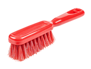 Red plastic cleaning brush isolated on black background