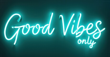 Bright neon sign displays Good Vibes only. Turquoise glow contrasts dark background. Positive message, stylish lettering. Simple design.
