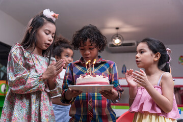 Group of  happy and enjoy kids have fun celebrating her birthday with Multinational friend kids birthday celebratiion party.