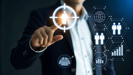Businessman targeting audience with digital interface, emphasizing marketing strategies and business growth in modern office
