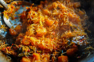 Close-up showcasing the vibrant colors and intricate textures of a delicious Asian stir-fry. The image captures the appetizing details of the dish, perfect for culinary enthusiasts and food bloggers.