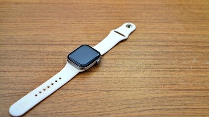 Hand holding a compact electric shaver. Personal care and grooming concept.