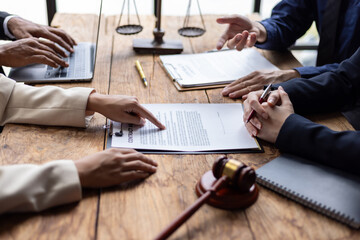 Lawyers and clients signing contract agreement after legal advice consultation. Lawyers and clients...
