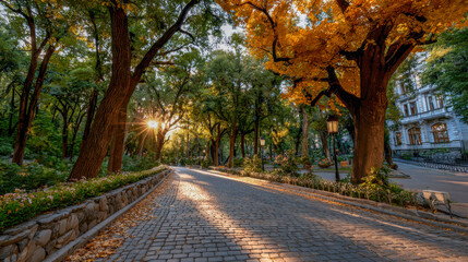 Naklejka premium Serene autumn park scene with golden leaves, sun rays filtering through trees, and a winding cobblestone path inviting peaceful strolls in nature's embrace